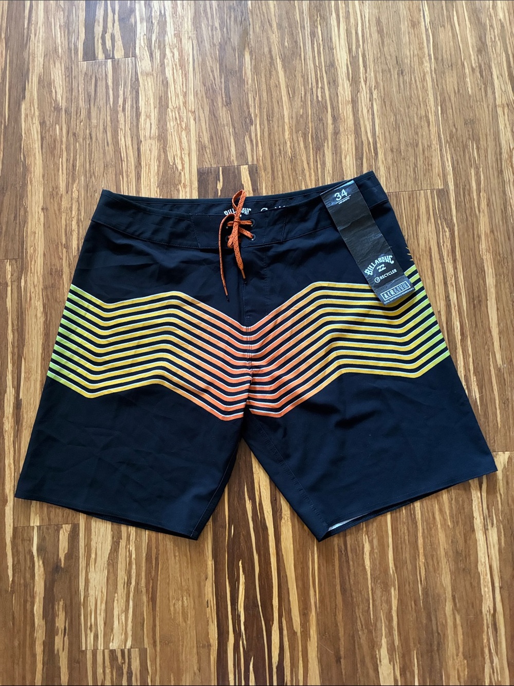 Billabong Black Board Shorts with Orange and Yellow Chevron Stripes